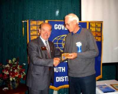 Herman Pittomvils (KI Counsellor for our district) presents Governor's patch to Tony Popplewell